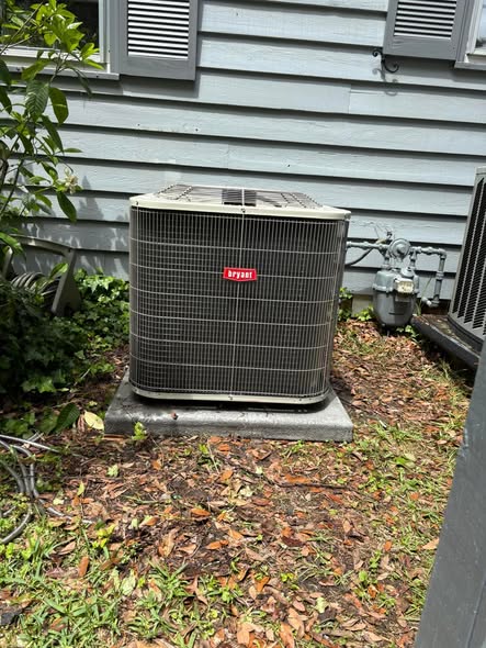 Bryant outdoor condenser unit installed on a concrete pad