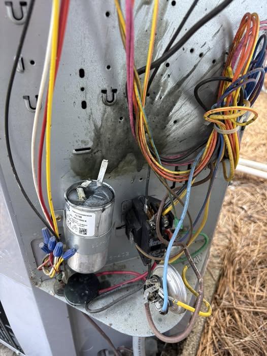 Electrical bay of an outdoor condenser unit during service