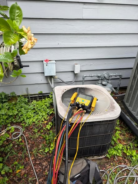 Manifold gauges connected to an outdoor unit for diagnostics