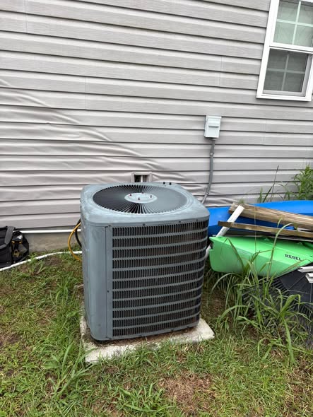 Outdoor air conditioning unit at a residential home on a RiverTown Cooling job